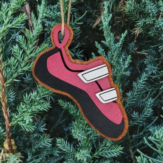 Rock Climbing Shoe Ornament. Red Wine and black climbing shoe ornament hanging on a Christmas tree.