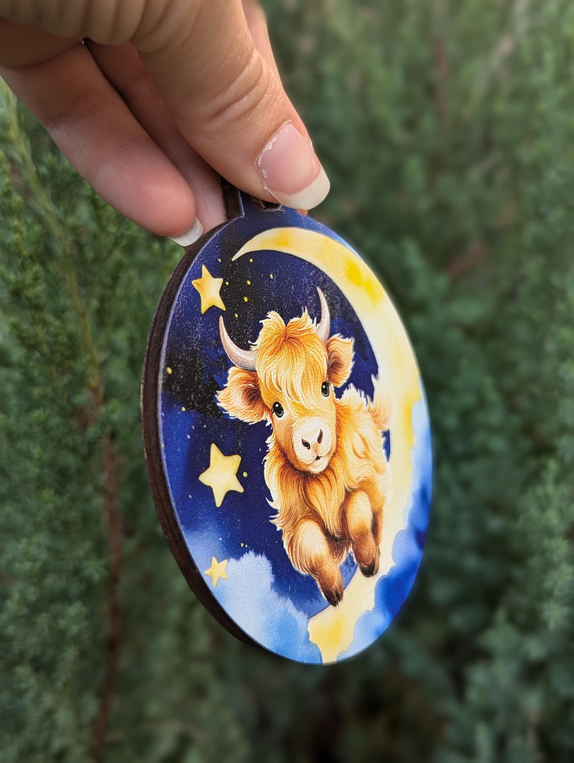 Highland Cow Jumping over the Moon Christmas Ornament